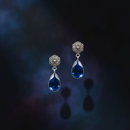 Antique Silver Floral Drop Earrings with Deep Blue Teardrop Stone
