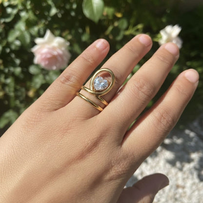 Elegant Open Oval Ring with Sparkling Heart Crystal