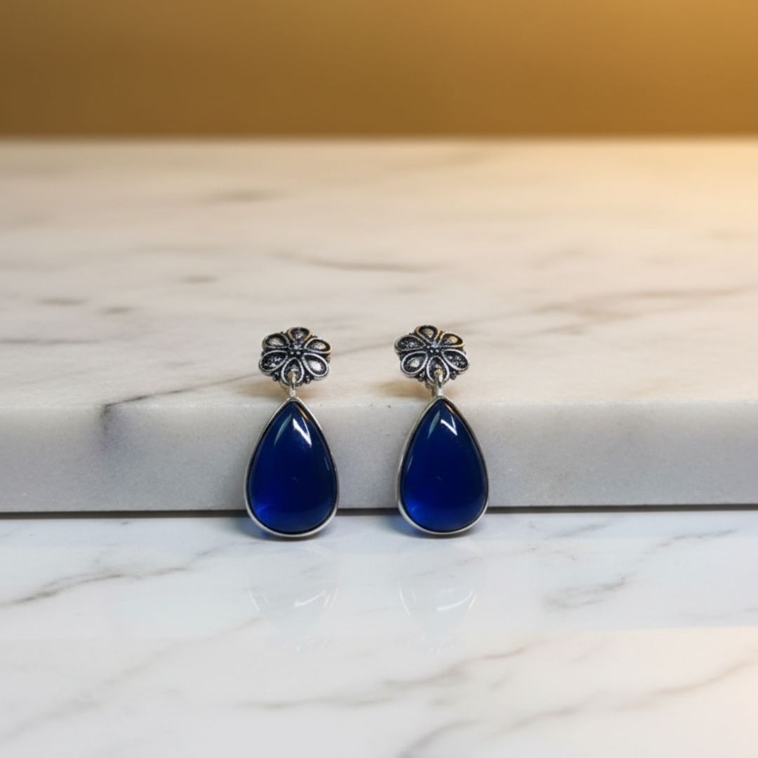 Antique Silver Floral Drop Earrings with Deep Blue Teardrop Stone