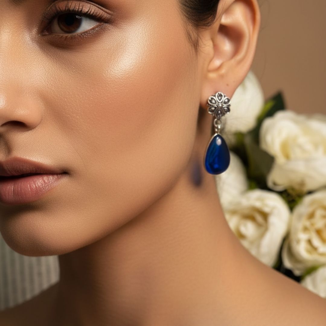 Antique Silver Floral Drop Earrings with Deep Blue Teardrop Stone