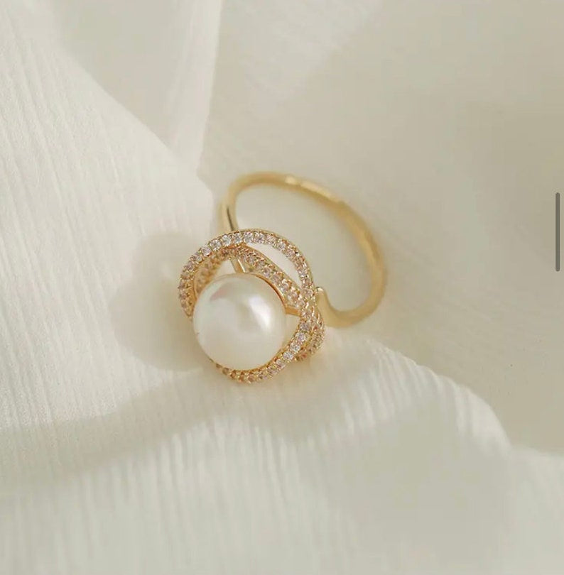 Gold Ring With Pearl And Crystal Halo